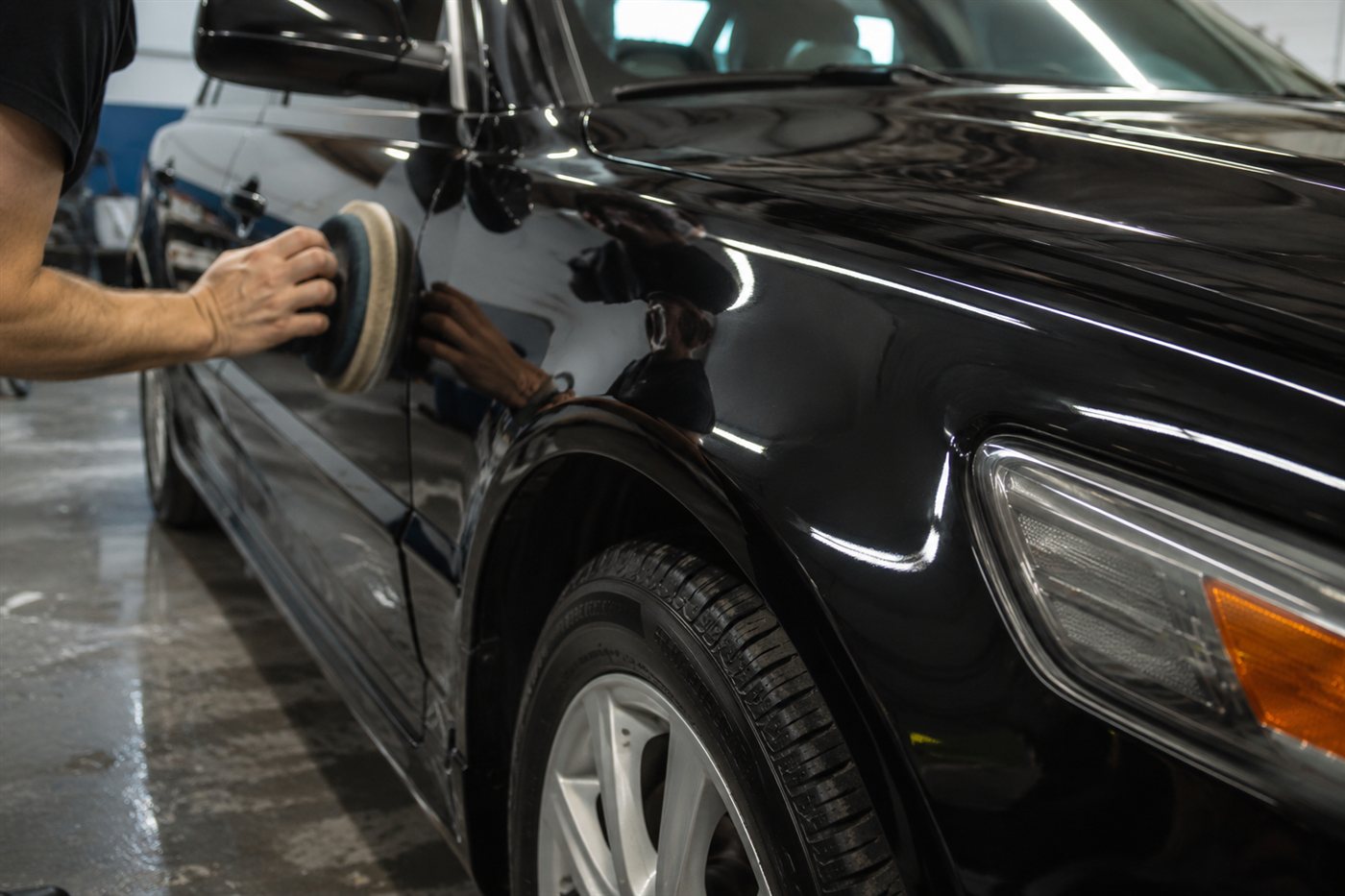 Machine polishing black paint to a gloss